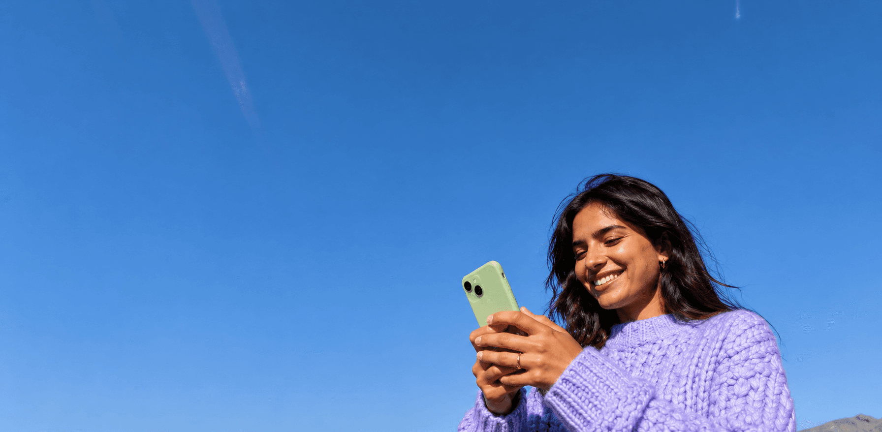 Creator using DMBix on her phone